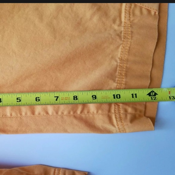 Annika Cutter and Buck Woman’s Orange Golf Shorts - Picture 7 of 7